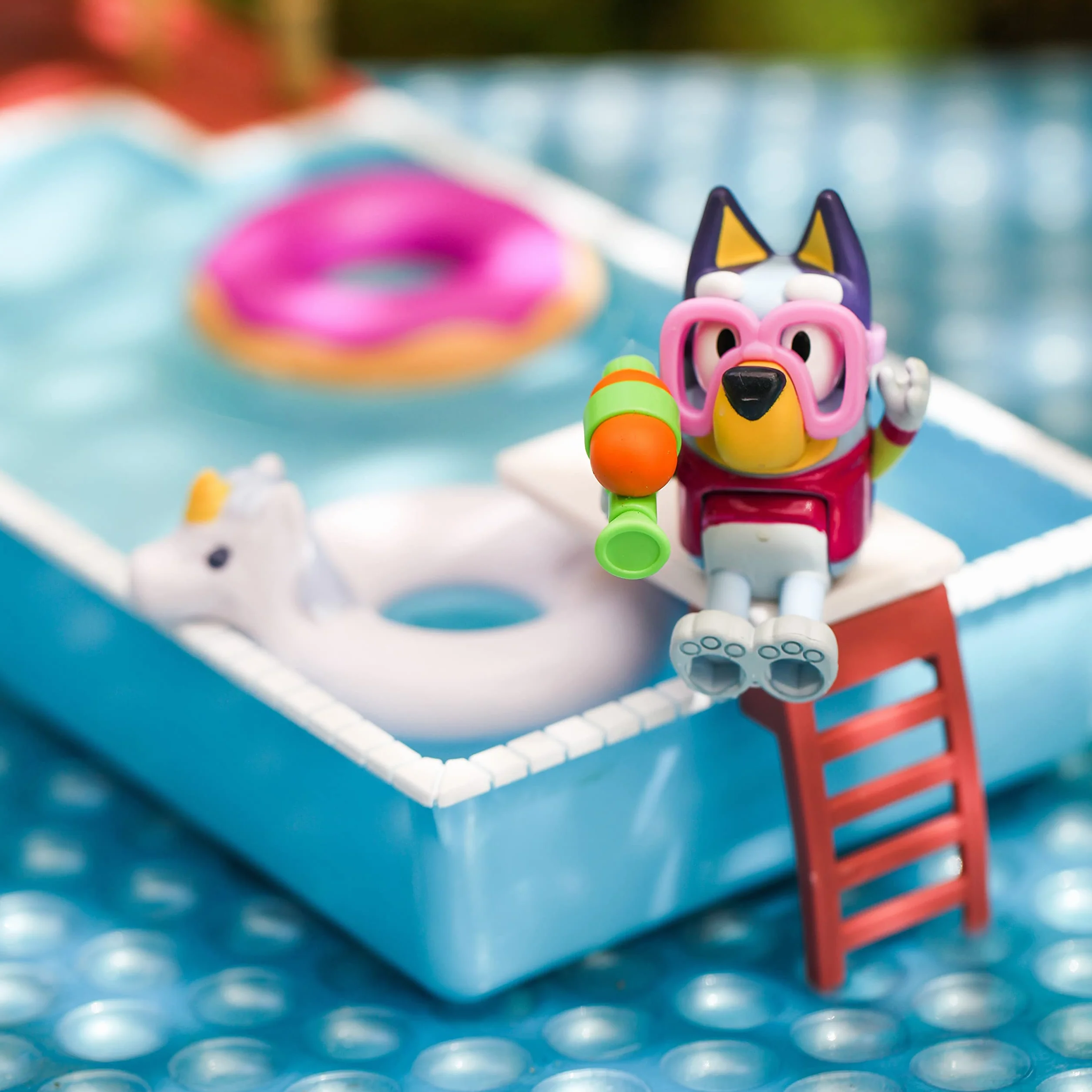 Bluey Pool Time Fun Playset: Bluey figure in Swim Suit, Pool with Diving Board and Deck and 4 Pool Accessories