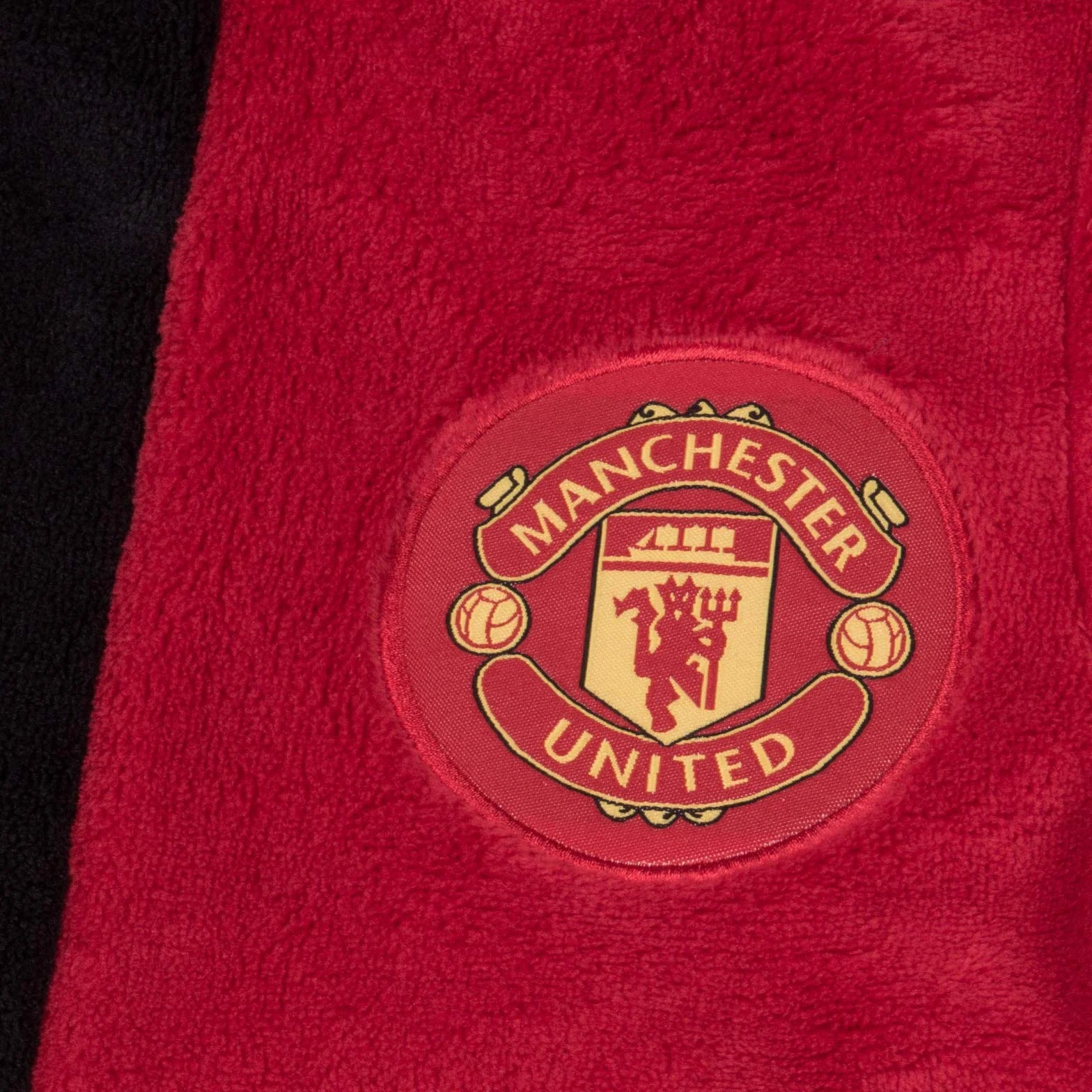 Manchester United F.C. - Szlafrok chłopięcy z kapturem - polarowy - oficjalne gadżety i akcesoria piłkarskie