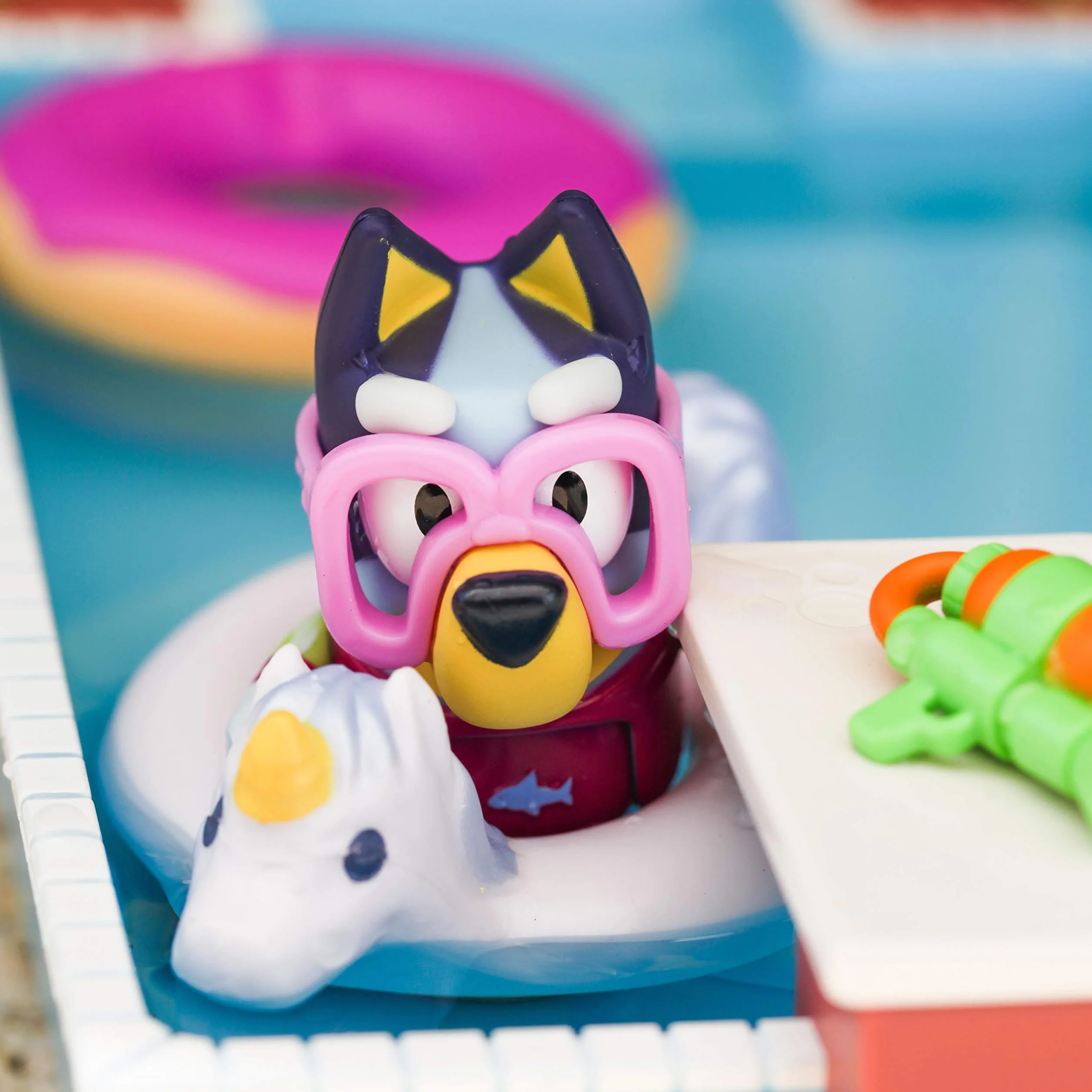 Bluey Pool Time Fun Playset: Bluey figure in Swim Suit, Pool with Diving Board and Deck and 4 Pool Accessories