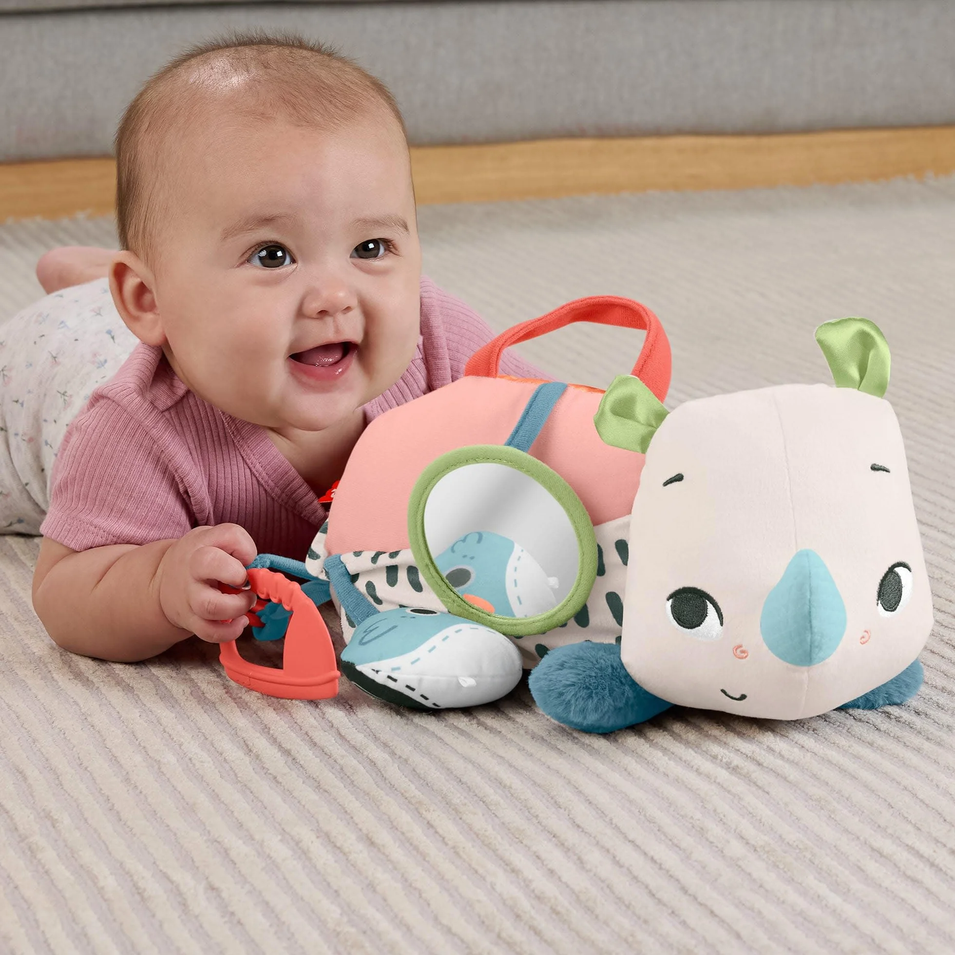 Fisher-Price Planet Friends Nosorożec aktywizujący Miękka zabawka sensoryczna do zabawy na brzuszku dla dzieci od narodzin, HYR55