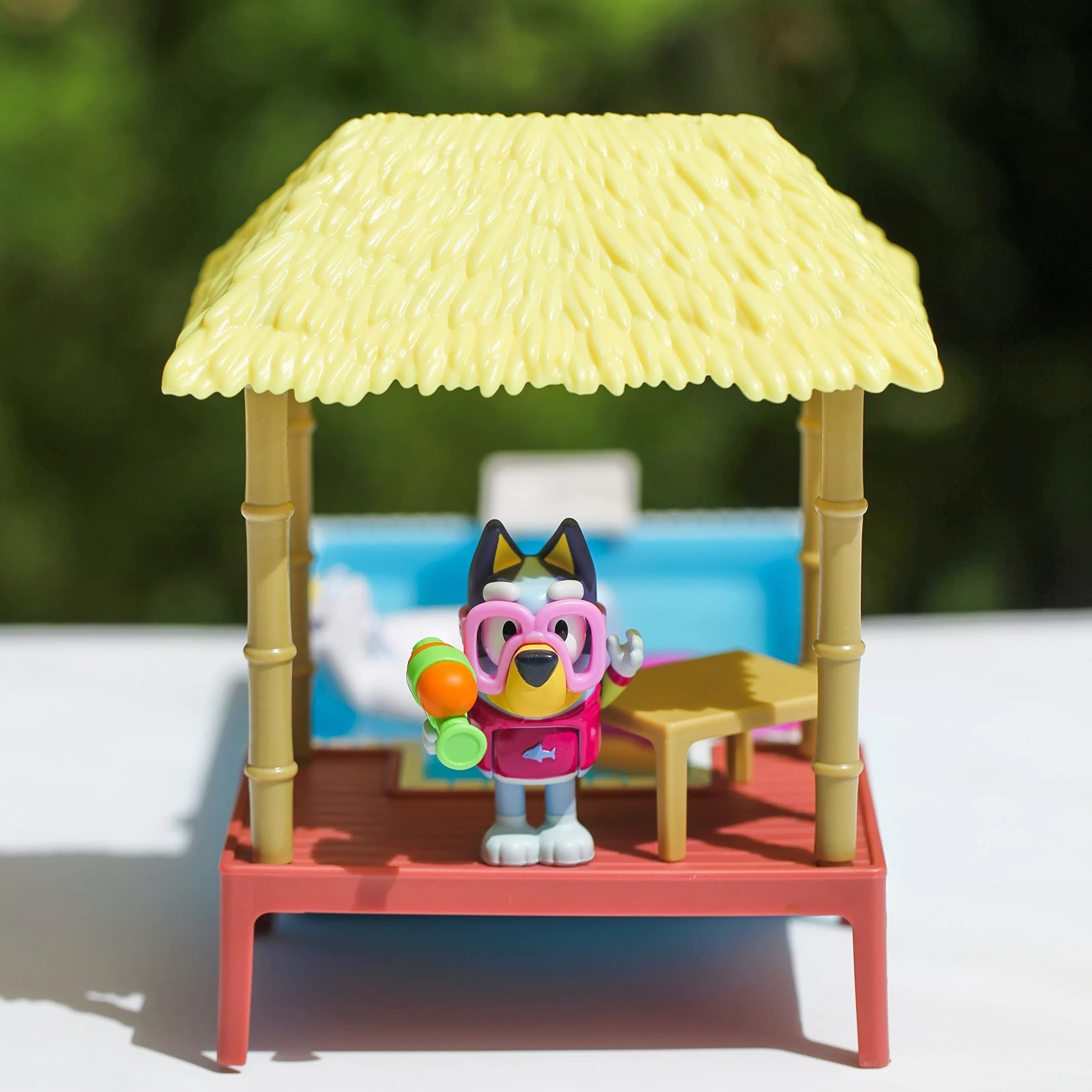 Bluey Pool Time Fun Playset: Bluey figure in Swim Suit, Pool with Diving Board and Deck and 4 Pool Accessories